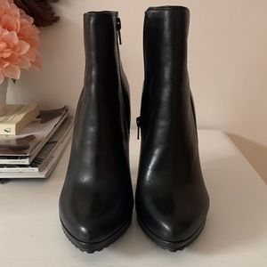 High heeled black boots